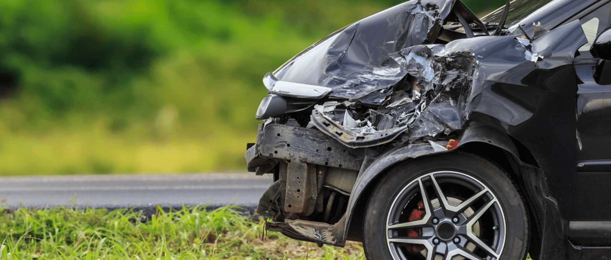 Front-of-black-car-get-damaged-by-accident-on-the-road