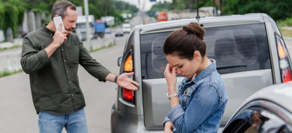 Upset Man And Woman Near Cars After Car Accident — Photo Scaled E x